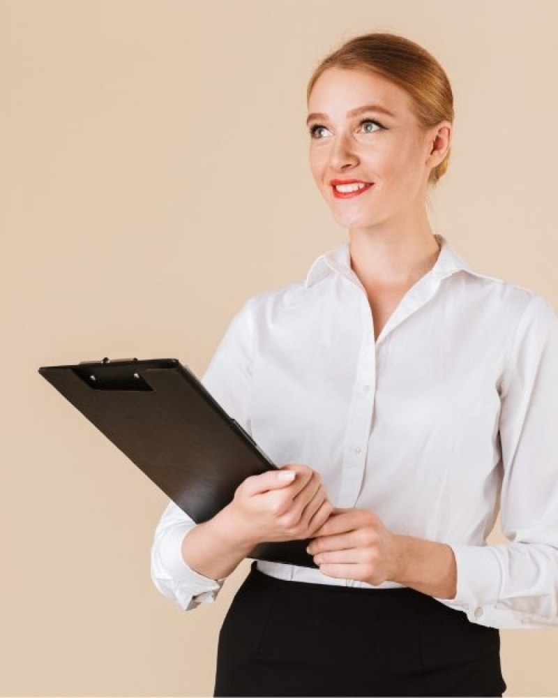 demo-attachment-20-amazing-business-woman-holding-clipboard-looking-8E2Y5Z7